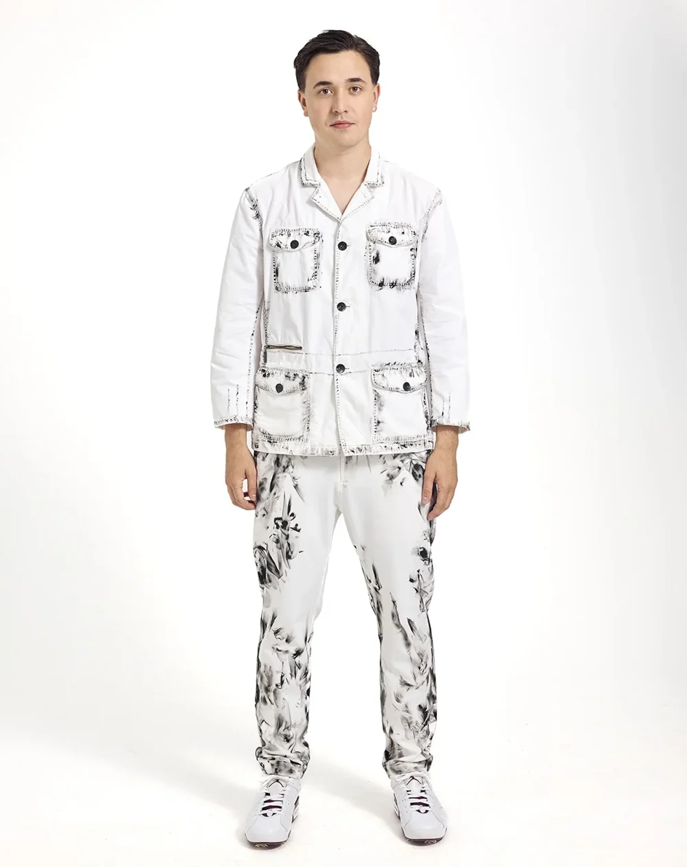 White jacket and trousers with black botanical details — design by DRESLOW