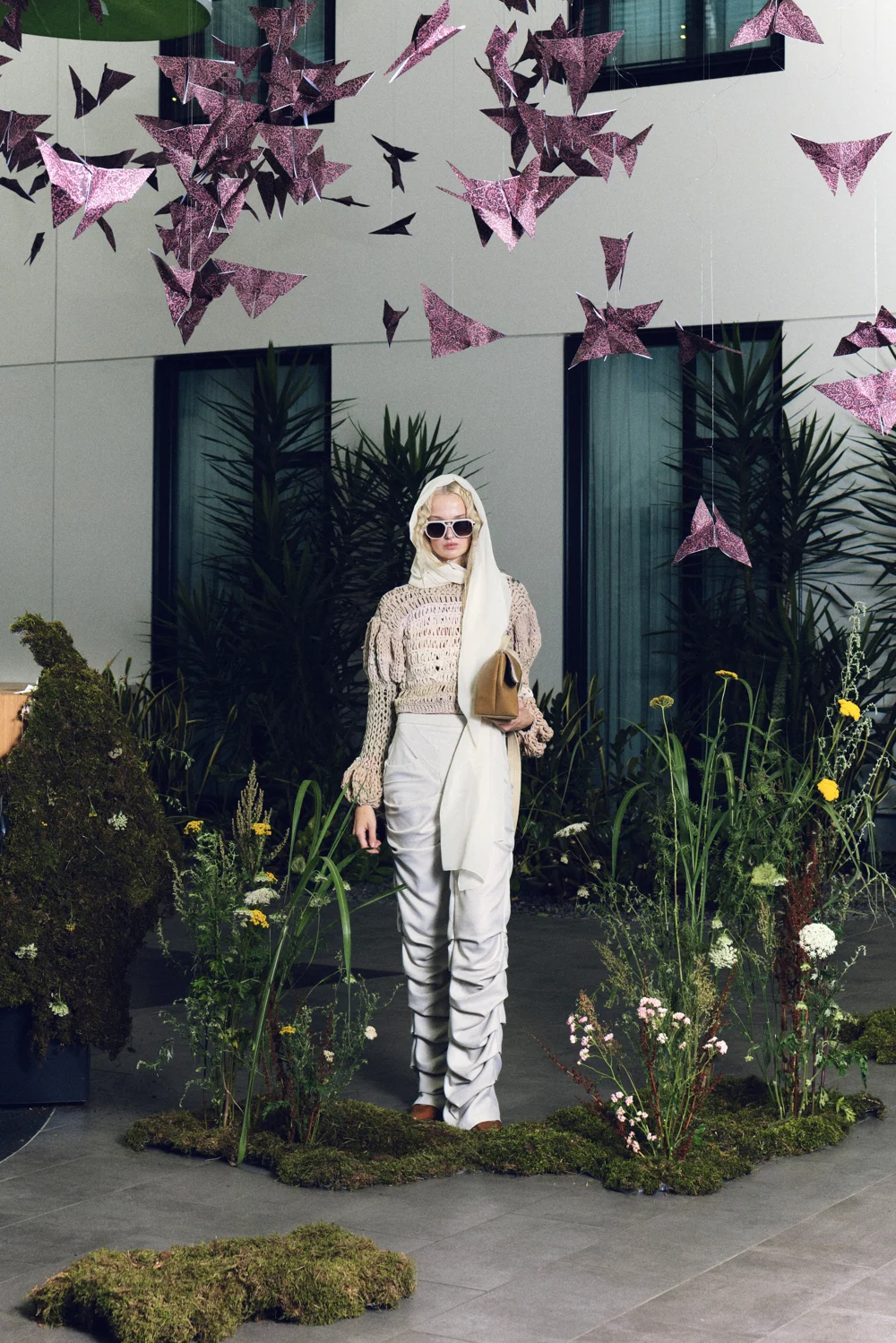 Open-knit top and white ruched trousers — design by IMPARI