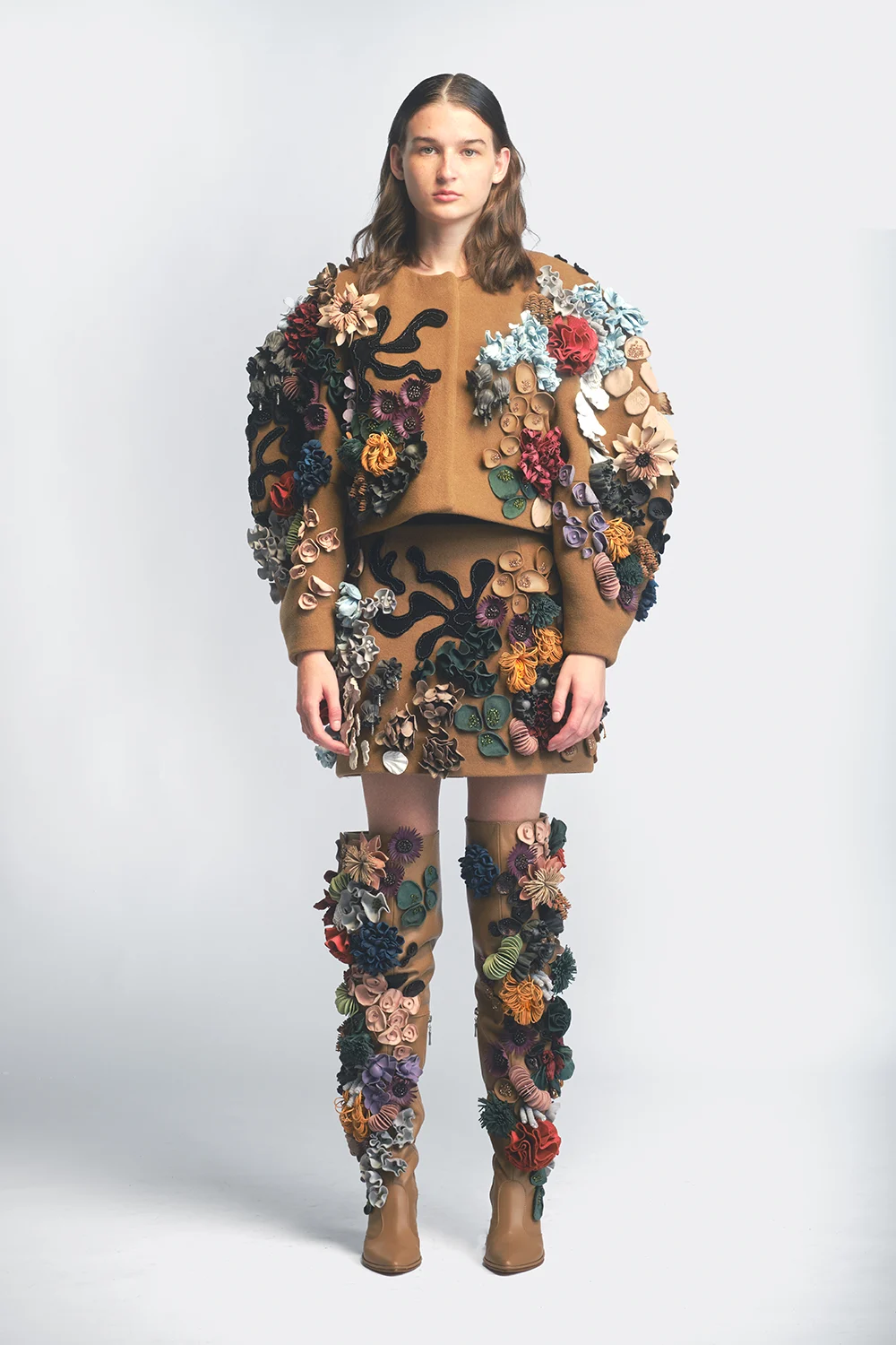 Floral embellished jacket, skirt and tall boots — design by Sandra Skorka