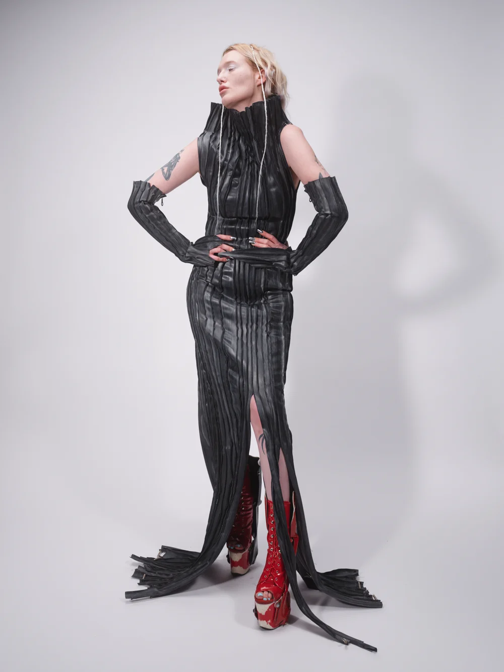 Black high-neck gown with a long train — design by SLVA